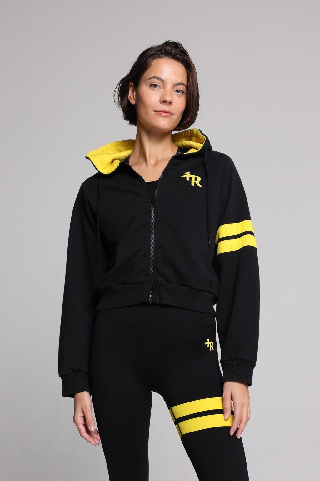 women in bicolor black performance jacket zip hoodie  with yellow stripes top premium luxury activewear by One More Reason high-performance fitness apparel