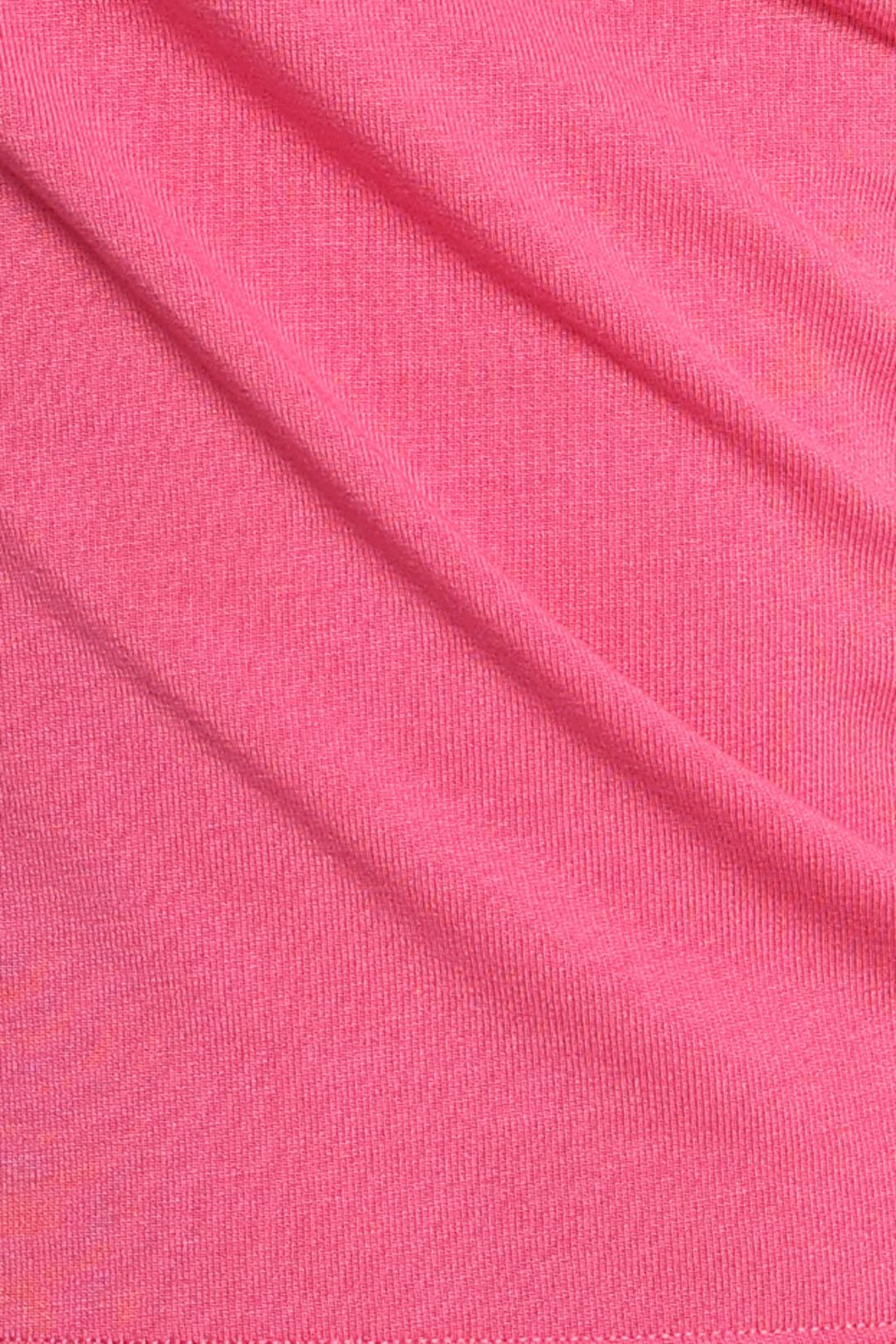 Close-up of pink lyocell blend fabric with visible texture