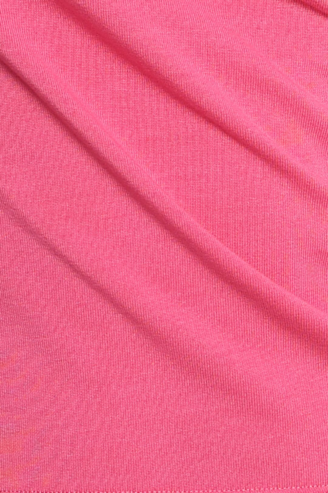 Close-up of pink lyocell blend fabric with visible texture