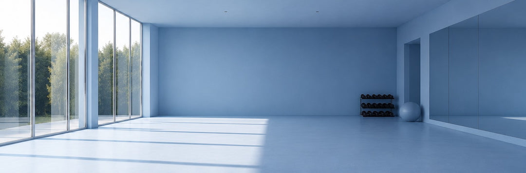 Modern sky blue gym room by One More Reason with large windows