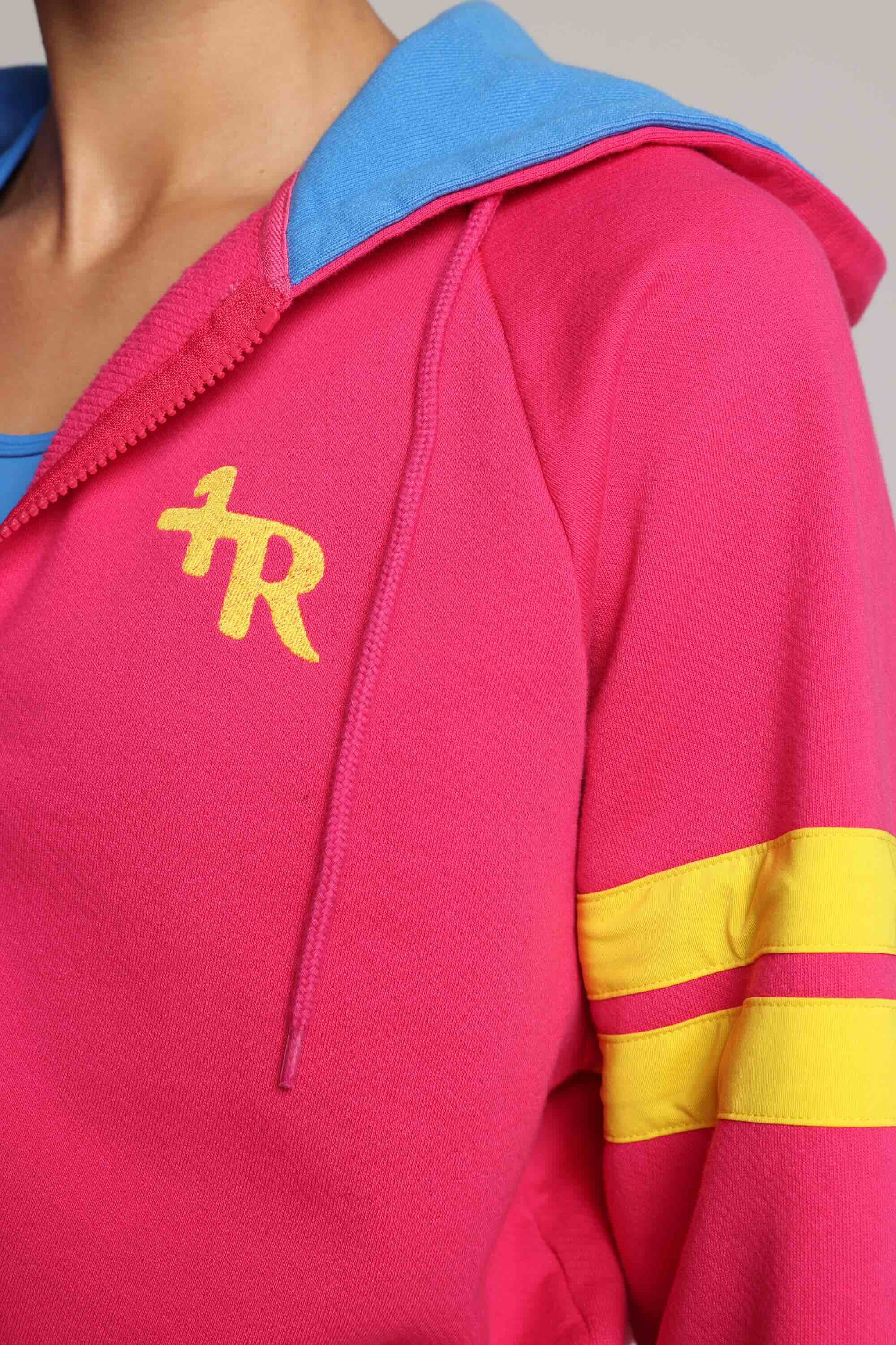 woman wearing bicolor organic cotton zip hoodie in pink and blue and blue tights  with yellow stripes by One More Reason, women's luxury activewear indoor set