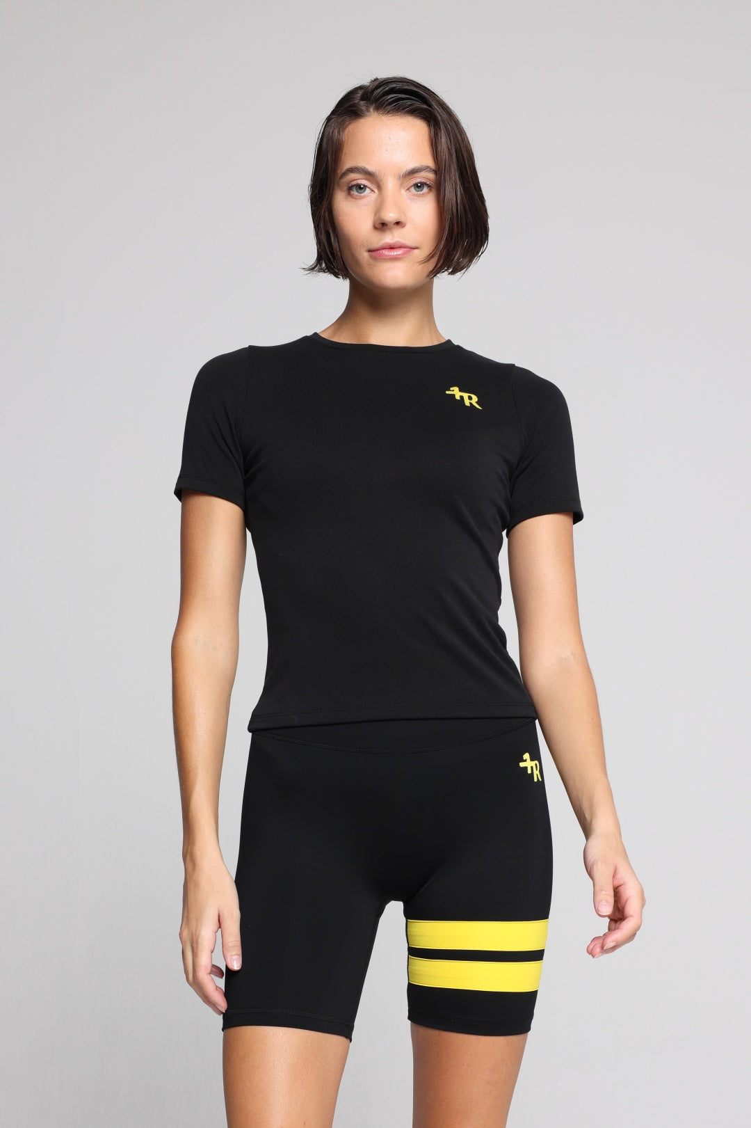 woman wearing deep black premium performance top from One More Reason