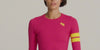 Woman in pink leggings and long sleeve top with yellow stripes by One More Reason is doing pilates.