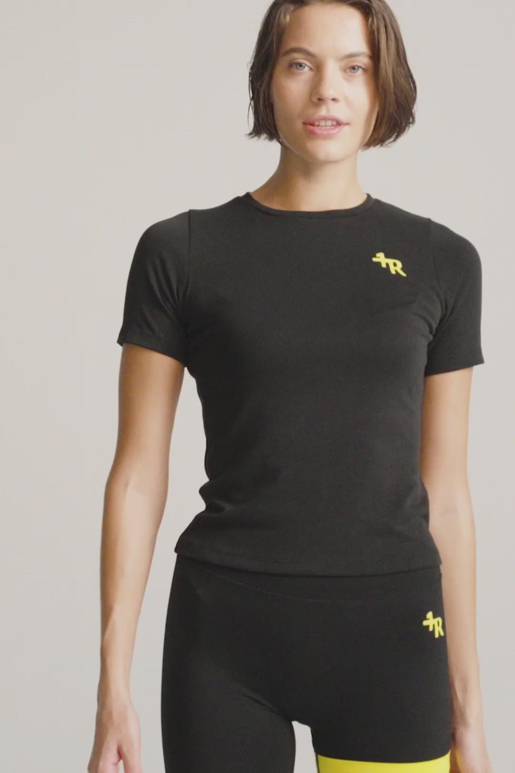 woman wearing deep black premium performance top from One More Reason